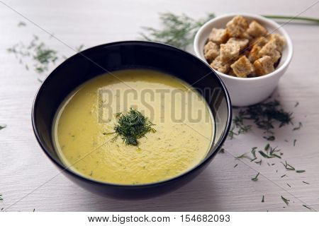 soup puree of zucchini in a black plate