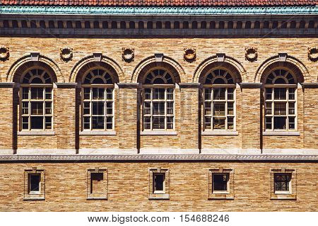 Architecture facade and windows of ancient renaissance style classical building Boston Library Massachusetts USA