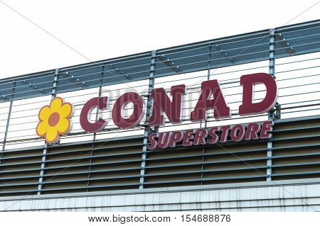 Forli Italy: 30th October 2016: Conad logo advertising sign outside its retail supermarket stores.