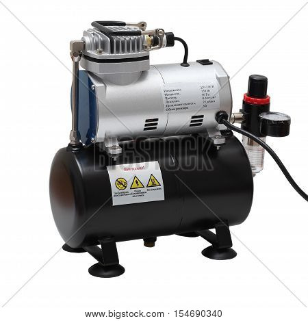 Portable car air compressor. Compressor on white background
