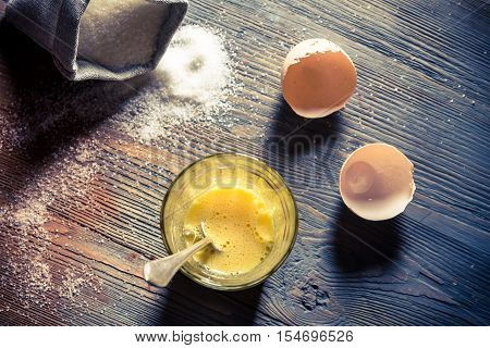 Simple dessert made of eggs and sugar on old wooden table