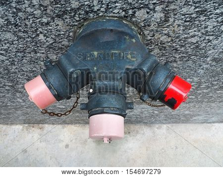 Metal standpipe on the public street for firefighter.