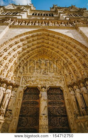 Close up of Notre Dame entrance doorway arch and carvings