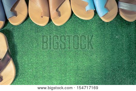 Slippers comfortable on the artificial grass.Tone retro style