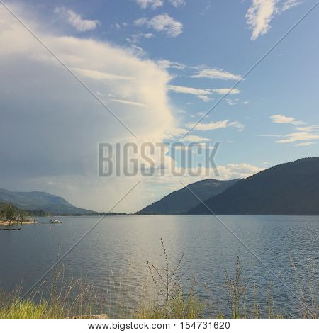 Storm cloud and reflection in lake. Instagram effects