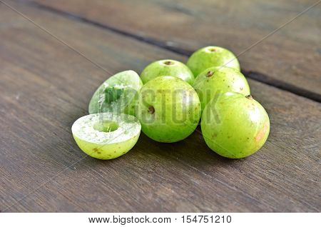Indian Gooseberry the wood background in natural light.