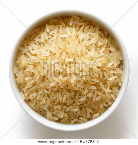 Bowl Of Long Grain Parboiled Rice Isolated On White From Above.