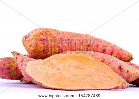 organic orange sweet potato yam and half sweet potato on white background healthy fruit food isolated