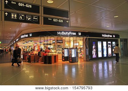 MUNICH, GERMANY - JULY 25, 2016: Duty free shop in Munich International Airport, Germany. The Munich Airport (MUC) Germany's second busiest airport is a major hub for Lufthansa (LH)