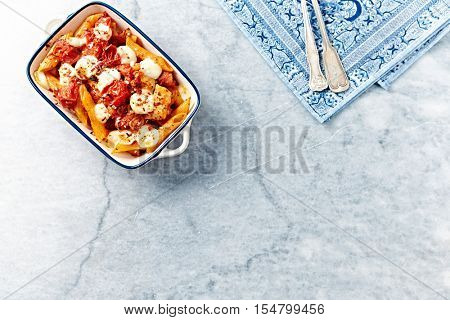 Pasta bake with chicken, tomatoes and mozzarella