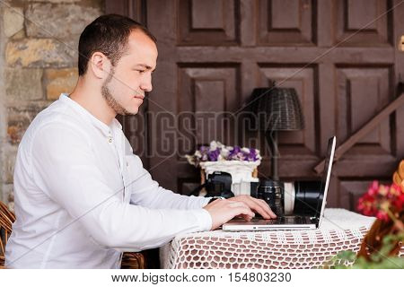 Man Is Looking At Laptop With Excitement.