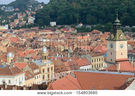 Clock tower and roof tiles in Brasov Transylvania Romania