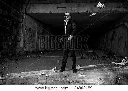 a young man in a rage throws the paper away