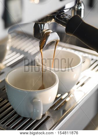 Espresso being made with a professional coffee machine.