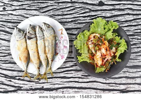 Thai food,Deep fired streamed - mackarel and fried spicy mixed herb  with squid.
