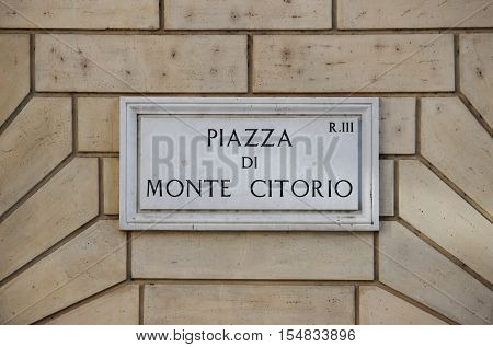 Old street sign at Montecitorio Square in Rome, Italy