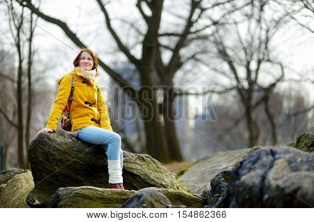 Young Woman Looking At Skyscrapers In Central Park