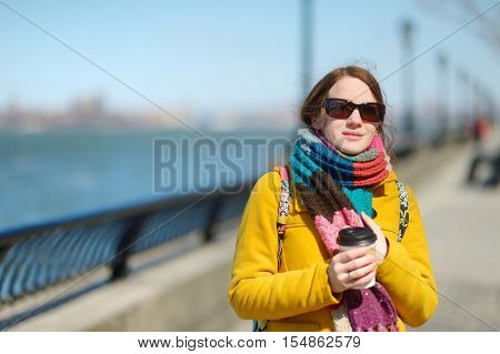 Beautiful Young Woman Drinking Coffee On Sunny Spring Day