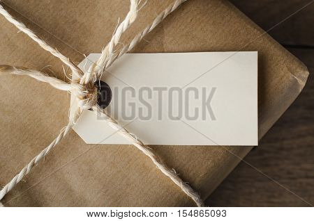 Close Up Of Blank Tag On String Tied Parcel