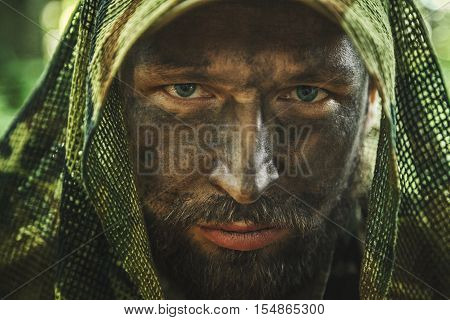 Member of Navy SEAL Team also known as Taliban hunter with weapons