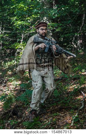 Member of Navy SEAL Team also known as Taliban hunter with weapons