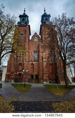 Towers of the gothic cathedral during autumn in Gniezno