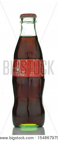 CIRCA SEPTEMBER 2016 - GDANSK: Bottle of original Coca-Cola drink isolated on white background. Coca-Cola is carbonated soft drink produced by Coca-Cola Company. Coca-Cola was introduced in 1886.