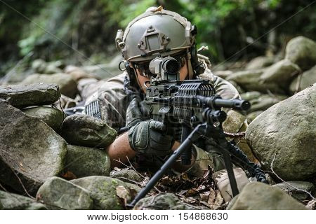United states army ranger machine gunner in the forest