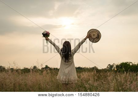Woman in meadow. travel and sunset soft and select focus
