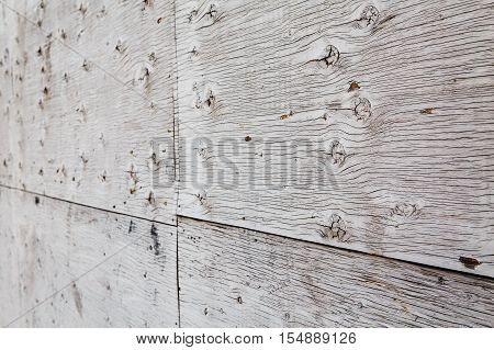 wooden board planks fence with lines kinks curves texture background rough surface