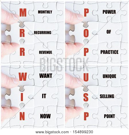 Hand Of Business Man Completing The Puzzle