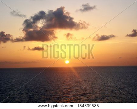 Clouds and tropical sunset over the ocean