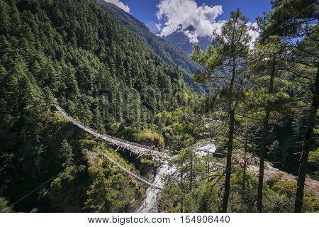 High view of of Hillary Suspension Bridges, New one and old one lower. Everest region, Nepal