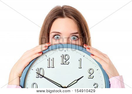 Woman holding clock with wondering eyes.Concept time.