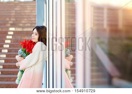 Romantic Girl With A Bouquet Of Red Tulips
