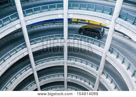 Car driving in multi storey car park.