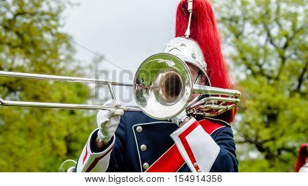 Close up and details of playing musicians instruments in a marching show band or music band
