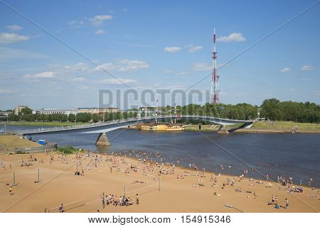 VELIKIY NOVGOROD, RUSSIA - JULY 04, 2015: View on the pedestrian bridge over the Volkhov river a sunny day in july. The tourist landmark of the city Veliky Novgorod, Russia