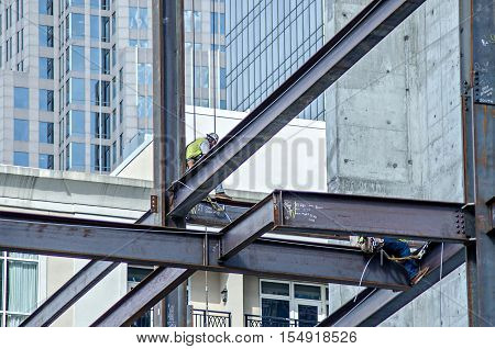 a construction worker working on highrise building