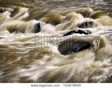 abstract background Wild turbid water in the river after rain