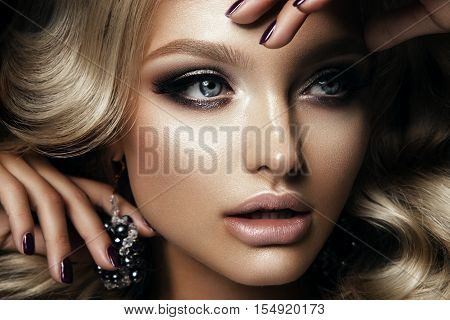 Beautyful girl with bright make up and beautiful hairstyle