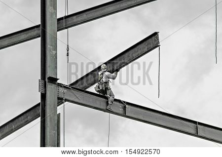 a construction worker working on highrise building