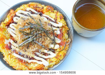 Japanese food okonomiyaki , Japanese pizza. Traditional food in Hiroshima, Japan