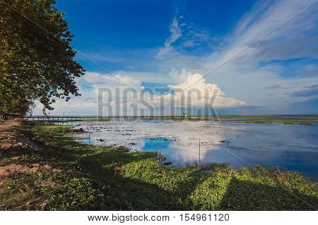 Beautiful view of the lake Phatthalung. sunny day evening Clouds reflected on the lakeThailand