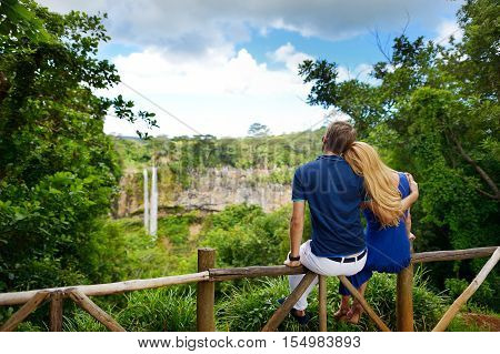 Young Couple Enjoying A View On Chamarel Falls Of Mauritius