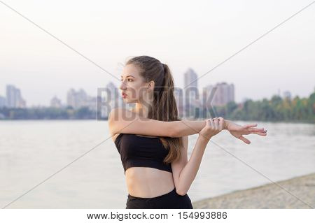 Sporty Woman Stretches Preparing For Fitness Training Workout Exercises Outdoor