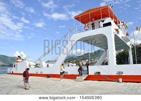 Herceg Novi, Montenegro - June 5, 2016: Passenger ferry at the pier of Herceg Novi with unknown tourists.