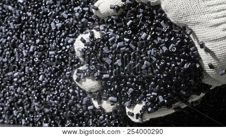 Plastic Black Gray Granulated Crumb. Manufacture Of Plastic Water Pipes Factory. Process Of Making P