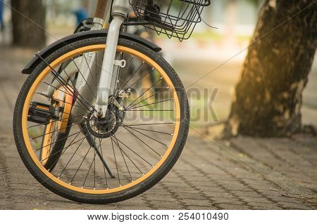 Phuket, Thailand - 10 August 2018- Black yellow Obike smart rental bicycle parking on footpath at Sa