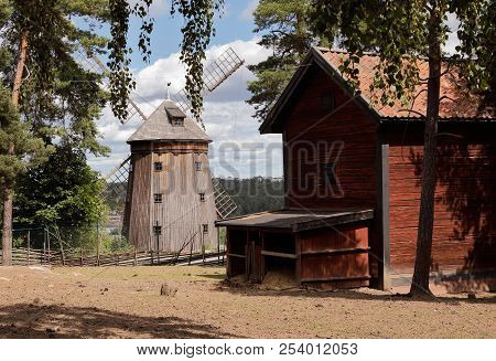 Sodertalje, Sweden - June 29, 2018: Barn And Windmill At The Torekallberget Open Air Museum.
